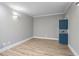 Spacious basement room with light gray walls and wood floors at 409 Angier Ne Ct, Atlanta, GA 30312