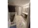 Elegant bathroom with marble flooring, a soaking tub, and double vanity at 409 Angier Ne Ct, Atlanta, GA 30312