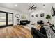 Modern living room with vaulted ceiling, dark furniture, and hardwood floors at 726 Charlotte Pl, Atlanta, GA 30318