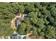 Aerial view showing home, pool, and lush surroundings at 1790 Garraux Nw Rd, Atlanta, GA 30327