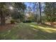 Spacious backyard with large trees and a shed at 1790 Garraux Nw Rd, Atlanta, GA 30327