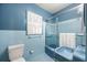 Light blue bathroom with shower/tub combo and updated vanity at 1790 Garraux Nw Rd, Atlanta, GA 30327