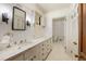 Elegant bathroom with marble vanity and hexagon tile flooring at 1790 Garraux Nw Rd, Atlanta, GA 30327
