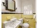 Retro bathroom with yellow tile and vintage style sink at 1790 Garraux Nw Rd, Atlanta, GA 30327