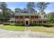 Brick colonial home with black shutters, stone driveway, and manicured lawn at 1790 Garraux Nw Rd, Atlanta, GA 30327