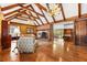 Gathering room with exposed beams, brick fireplace, hardwood floors, and built-ins at 1790 Garraux Nw Rd, Atlanta, GA 30327