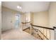 Upstairs hallway with carpeted flooring and access to bedrooms at 1790 Garraux Nw Rd, Atlanta, GA 30327