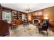 Cozy library with built-in bookshelves, fireplace and leather chairs at 1790 Garraux Nw Rd, Atlanta, GA 30327