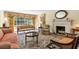 Spacious living room with hardwood floors, fireplace and large windows at 1790 Garraux Nw Rd, Atlanta, GA 30327