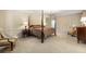 Main bedroom with a four-poster bed and window seating area at 1790 Garraux Nw Rd, Atlanta, GA 30327