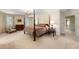 Main bedroom with four poster bed and ample closet space at 1790 Garraux Nw Rd, Atlanta, GA 30327