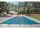 Inviting swimming pool with a safety cover and spacious deck at 1790 Garraux Nw Rd, Atlanta, GA 30327