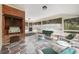 Relaxing screened porch with built-in grill and patio furniture at 1790 Garraux Nw Rd, Atlanta, GA 30327