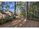 Landscaped yard with tall pines and manicured shrubs at 1790 Garraux Nw Rd, Atlanta, GA 30327