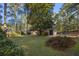Expansive backyard with mature trees and manicured shrubs at 1790 Garraux Nw Rd, Atlanta, GA 30327