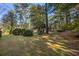 Large backyard with shed, lush grass, and mature trees at 1790 Garraux Nw Rd, Atlanta, GA 30327
