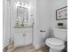Bathroom features include new vanity, toilet, shower with glass doors and custom mirror at 1092 Donnelly Sw Ave, Atlanta, GA 30310