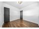 Bedroom features include hardwood floors, white walls, window, and two entry doors at 1092 Donnelly Sw Ave, Atlanta, GA 30310
