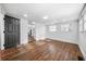 Bedroom features hardwood floors, white walls, black door, and natural light at 1092 Donnelly Sw Ave, Atlanta, GA 30310