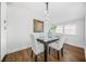 Elegant dining room with modern light fixture, wood floors and bright windows create a warm atmosphere at 1092 Donnelly Sw Ave, Atlanta, GA 30310
