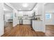 Bright kitchen with white cabinets, stainless steel appliances, and granite countertops offer style and function at 1092 Donnelly Sw Ave, Atlanta, GA 30310