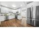 Beautiful kitchen with stainless steel appliances, wooden floors and white cabinets providing modern living at 1092 Donnelly Sw Ave, Atlanta, GA 30310