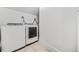 Bright laundry area featuring modern, front-loading washer and dryer units at 1092 Donnelly Sw Ave, Atlanta, GA 30310