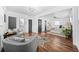 Spacious living room leads to bedroom featuring hardwood floors, bright windows and flexible layout at 1092 Donnelly Sw Ave, Atlanta, GA 30310