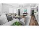 Cozy living room with large windows and hardwood floors offering natural light and comfortable seating at 1092 Donnelly Sw Ave, Atlanta, GA 30310