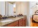 Bathroom with double sinks, granite countertop, and modern fixtures at 1731 Panorama Dr, Locust Grove, GA 30248