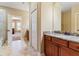 Bathroom features double vanities with granite countertops and tile flooring at 1731 Panorama Dr, Locust Grove, GA 30248