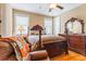 Bedroom with a wooden bed frame and a mirrored dresser at 1731 Panorama Dr, Locust Grove, GA 30248