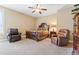 Comfortable bedroom with two leather armchairs at 1731 Panorama Dr, Locust Grove, GA 30248