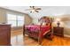 Bright bedroom with hardwood floors and a ceiling fan at 1731 Panorama Dr, Locust Grove, GA 30248