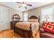 Bedroom with hardwood floors and a wooden bed frame at 1731 Panorama Dr, Locust Grove, GA 30248