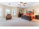 Large bedroom with carpeted floors and plenty of natural light at 1731 Panorama Dr, Locust Grove, GA 30248