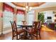 Bright breakfast nook features a round table with four chairs, perfect for casual meals at 1731 Panorama Dr, Locust Grove, GA 30248