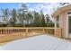 Wooden deck overlooking backyard, covered in snow at 1731 Panorama Dr, Locust Grove, GA 30248