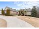 Two-story house with a circular driveway and landscaping at 1731 Panorama Dr, Locust Grove, GA 30248