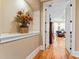 Bright hallway with hardwood floors and access to bedroom at 1731 Panorama Dr, Locust Grove, GA 30248