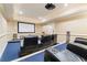 Home theater with large screen, comfortable seating, and surround sound at 1731 Panorama Dr, Locust Grove, GA 30248