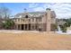 Brick house with a large backyard and deck, snow on the ground at 1731 Panorama Dr, Locust Grove, GA 30248