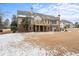 Brick house with a large backyard and deck, snow on the ground at 1731 Panorama Dr, Locust Grove, GA 30248