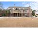 Brick house with a large backyard and deck, snow on the ground at 1731 Panorama Dr, Locust Grove, GA 30248
