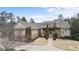 Brick house with a large front yard and circular driveway at 1731 Panorama Dr, Locust Grove, GA 30248
