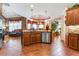 Spacious kitchen with island, stainless steel appliances, and tile flooring at 1731 Panorama Dr, Locust Grove, GA 30248