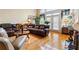 Relaxing living room with hardwood floors and sectional sofa at 1731 Panorama Dr, Locust Grove, GA 30248