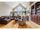 Spacious living room with hardwood floors, fireplace, and built-in shelving at 1731 Panorama Dr, Locust Grove, GA 30248
