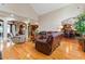 Open living room with hardwood floors and a view to kitchen at 1731 Panorama Dr, Locust Grove, GA 30248
