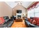 Living room with hardwood floors, fireplace and ample natural light at 1731 Panorama Dr, Locust Grove, GA 30248